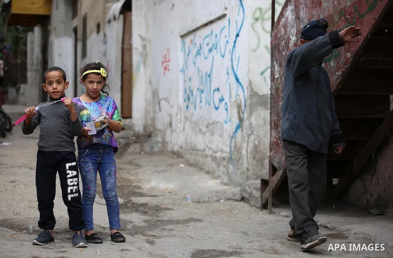 Palestinians paly outside their house at Balata refugee camp near in the West Bank city of Nablus, on November 1, 2017. This week, Palestinians around the world are marking 100 years since the Balfour Declaration was iss...