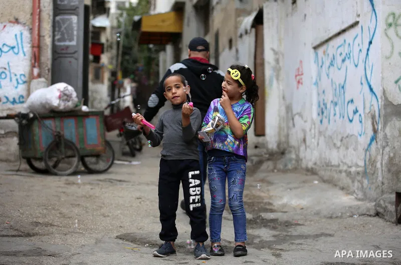 Palestinians paly outside their house at Balata refugee camp near in the West Bank city of Nablus, on November 1, 2017. This week, Palestinians around the world are marking 100 years since the Balfour Declaration was iss...