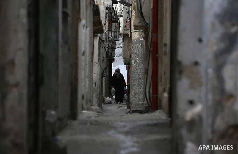 A Palestinian woman walks on a street at Balata refugee camp near in the West Bank city of Nablus, on November 1, 2017. This week, Palestinians around the world are marking 100 years since the Balfour Declaration was iss...