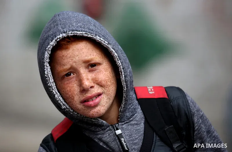 A Palestinian boy poses a camera at the Balata refugee camp near the West Bank city of Nablus, on November 1, 2017. This week, Palestinians around the world are marking 100 years since the Balfour Declaration was issued...