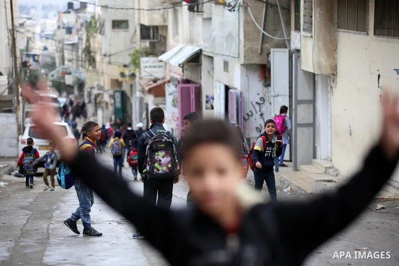 Palestinian students play on a street at the Balata refugee camp near the West Bank city of Nablus, on November 1, 2017. This week, Palestinians around the world are marking 100 years since the Balfour Declaration was is...