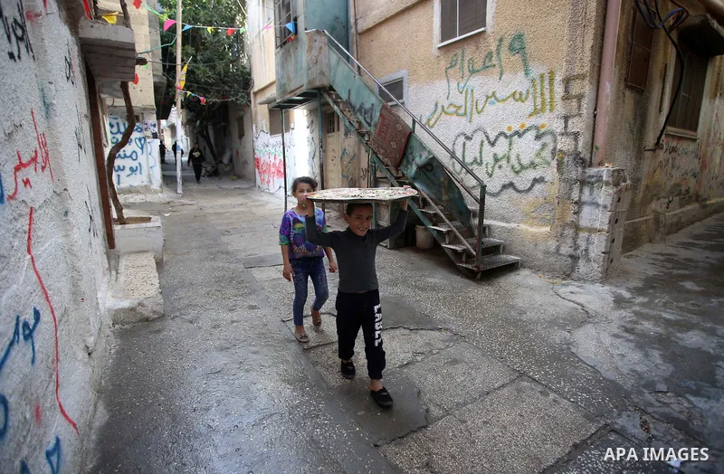 Palestinians paly outside their house at Balata refugee camp near in the West Bank city of Nablus, on November 1, 2017. This week, Palestinians around the world are marking 100 years since the Balfour Declaration was iss...