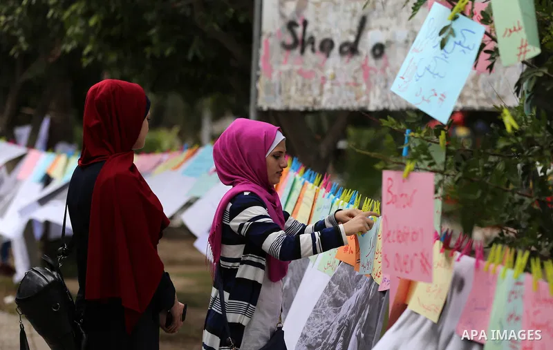Palestinians writ on the papers during a protest against the 100th anniversary of Britain's Balfour Declaration in Gaza City on November 2, 2017, which helped lead to Israel's creation and the Israeli-Palestinian conflic...
