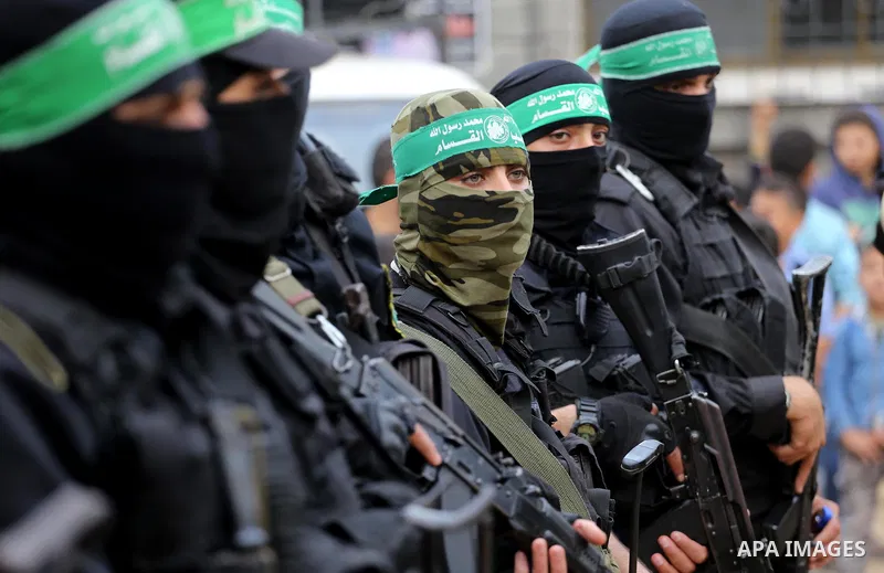 Palestinian militants from various local factions take part in a military parade to mark the fifth anniversary of Ahmed al-Jabari death, the late leader of Ezzedine al-Qassam Brigades, the armed wing of the Palestinian H...