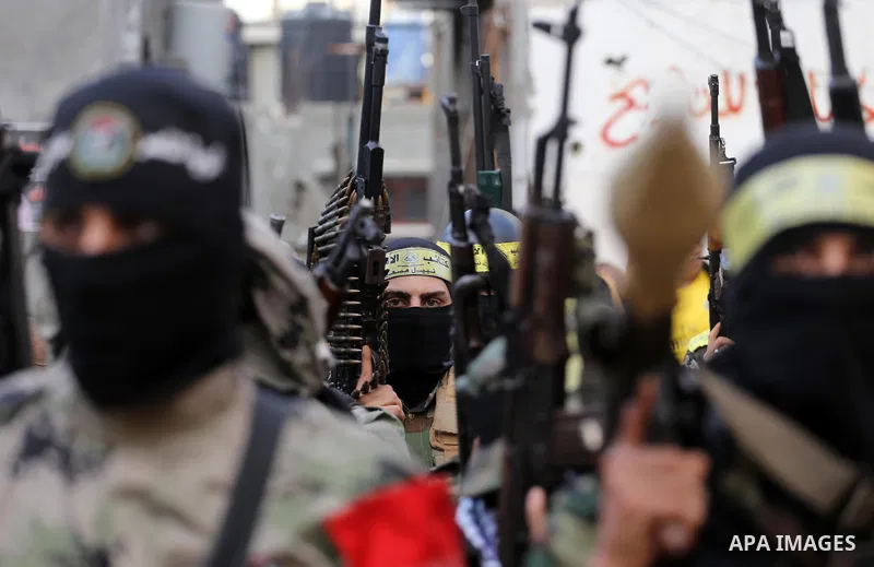 Palestinian militants from various local factions take part in a military parade to mark the fifth anniversary of Ahmed al-Jabari death, the late leader of Ezzedine al-Qassam Brigades, the armed wing of the Palestinian H...