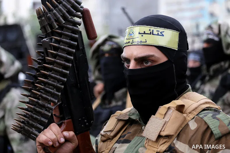 Palestinian militants from various local factions take part in a military parade to mark the fifth anniversary of Ahmed al-Jabari death, the late leader of Ezzedine al-Qassam Brigades, the armed wing of the Palestinian H...