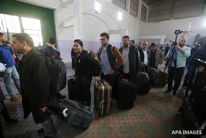 Palestinians wait for travel permits to cross into Egypt under the control of the Palestinian Authority, in Khan Younis in the southern Gaza Strip November 18, 2017, as it opened for three days for the first time since t...