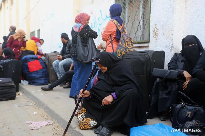 Palestinians wait for travel permits to cross into Egypt under the control of the Palestinian Authority, in Khan Younis in the southern Gaza Strip November 18, 2017, as it opened for three days for the first time since t...