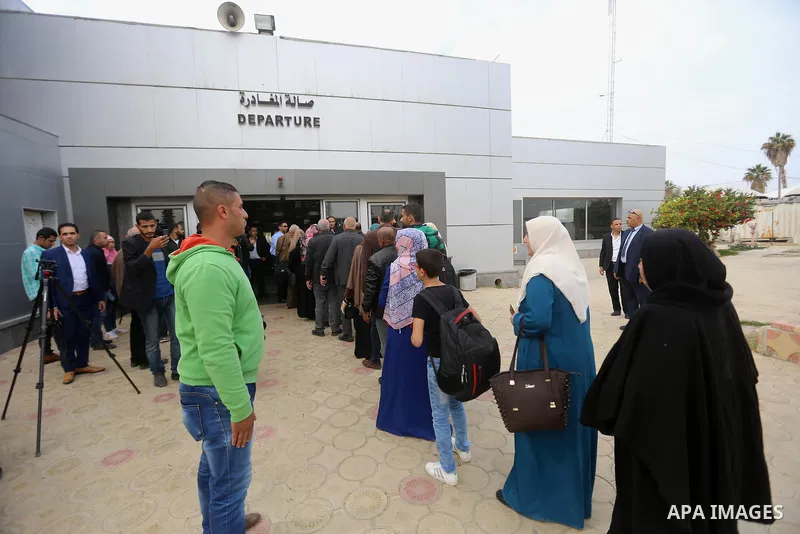 Palestinians wait at the Rafah border crossing with Egypt, under the control of the Palestinian Authority, before being allowed to pass out of the southern Gaza Strip on November 18, 2017, after it opened for three days...