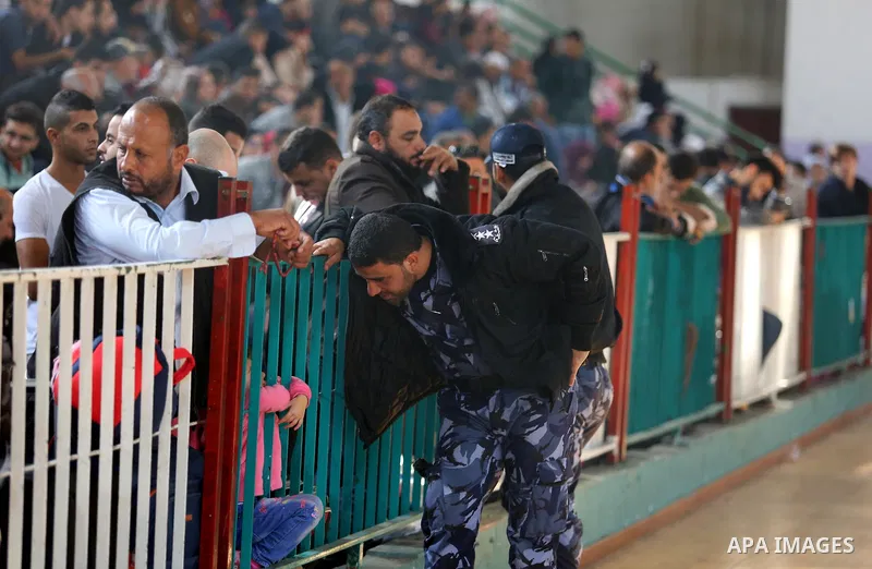Palestinians wait for travel permits to cross into Egypt under the control of the Palestinian Authority, in Khan Younis in the southern Gaza Strip November 18, 2017, as it opened for three days for the first time since t...