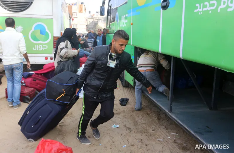 Palestinians wait for travel permits to cross into Egypt under the control of the Palestinian Authority, in Khan Younis in the southern Gaza Strip November 18, 2017, as it opened for three days for the first time since t...
