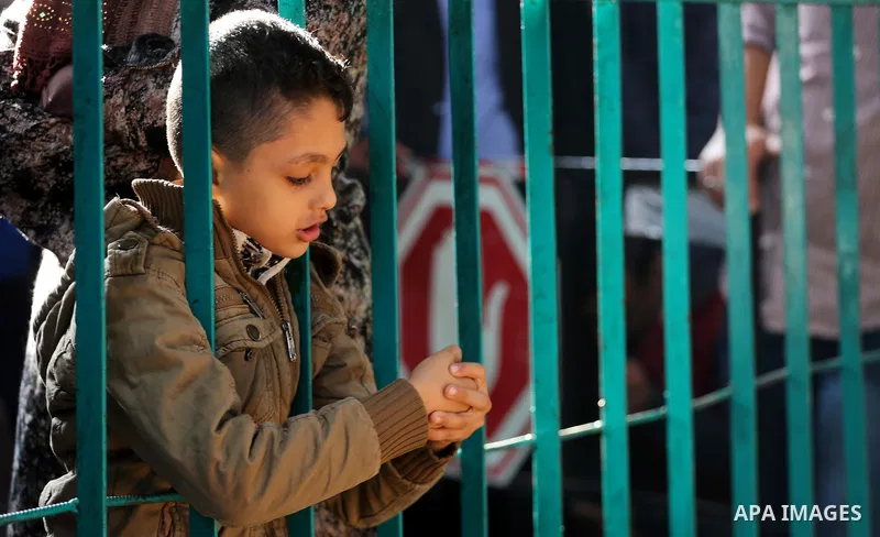 Palestinians wait for travel permits to cross into Egypt, after Rafah border crossing was opened under control of the Western-backed Palestinian Authority for the first time since 2007, in Khan Younis in the southern Gaz...