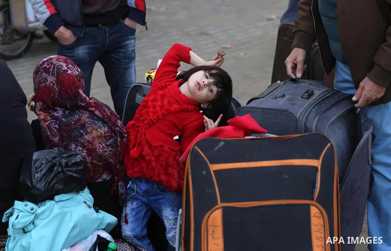 Palestinians wait for travel permits to cross into Egypt, after Rafah border crossing was opened under control of the Western-backed Palestinian Authority for the first time since 2007, in Khan Younis in the southern Gaz...