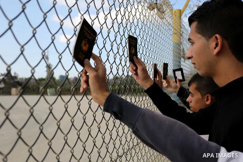 Palestinian students shout outside Rafah border crossing demanding to travel to complete their study abroad in the southern Gaza Strip on November 20, 2017, following its opening for three days for the first time since a...