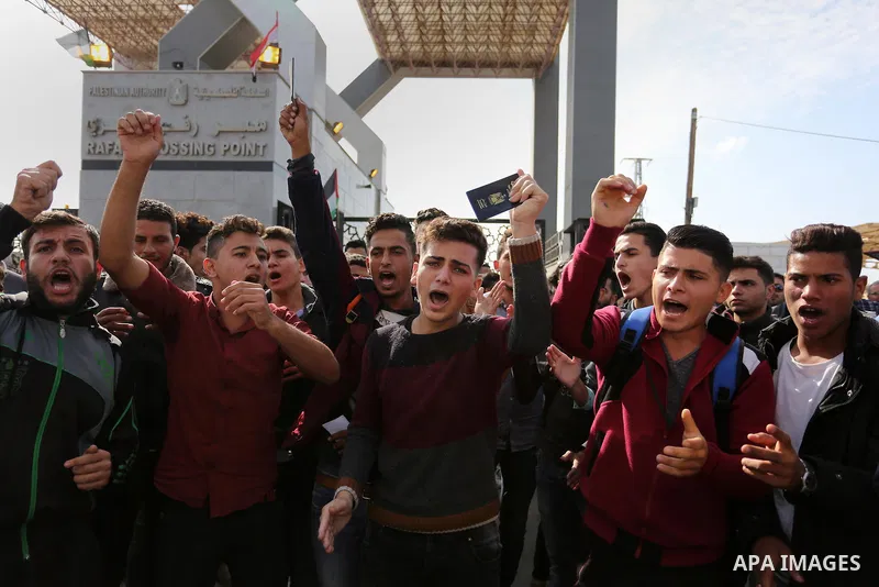 Palestinian students shout outside Rafah border crossing demanding to travel to complete their study abroad in the southern Gaza Strip on November 20, 2017, following its opening for three days for the first time since a...