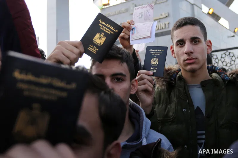 Palestinian students shout outside Rafah border crossing demanding to travel to complete their study abroad in the southern Gaza Strip on November 20, 2017, following its opening for three days for the first time since a...