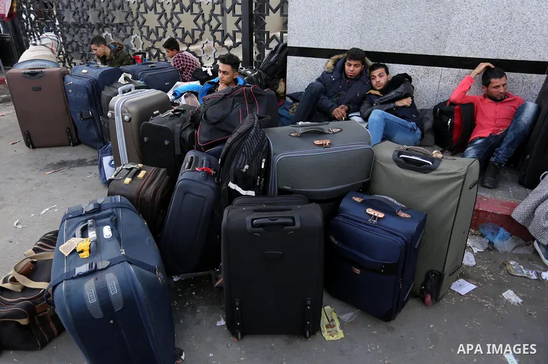 Palestinians wait to cross at the Rafah border crossing with Egypt before being allowed to pass out of the southern Gaza Strip on November 20, 2017, following its opening for three days for the first time since a Palesti...