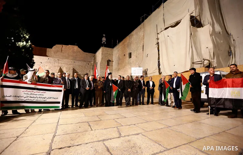 Palestinians take part in a protest in solidarity with Egyptian people after the deadly attack on a mosque in Egypt's Sinai, in the West Bank city of Bethlehem, on Nov. 25, 2017. According to latest reports, a bomb and g...