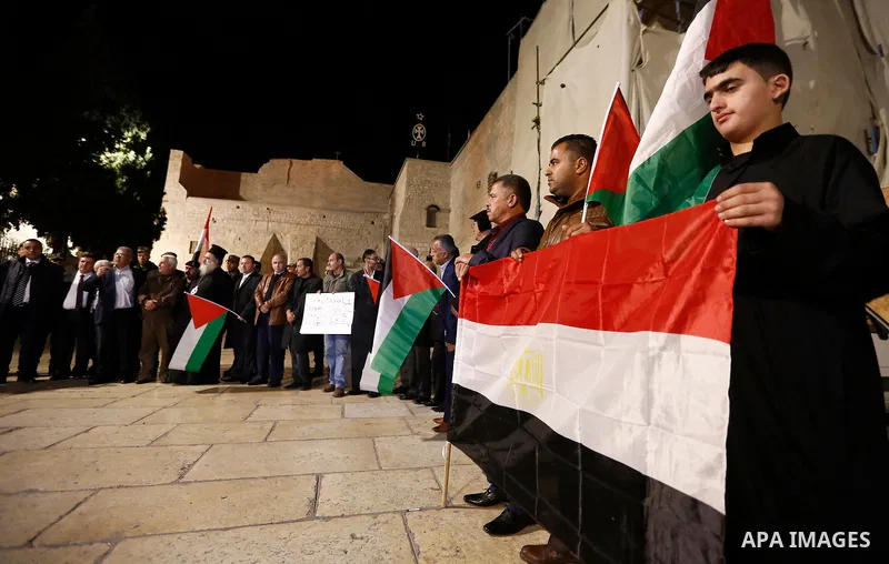 Palestinians take part in a protest in solidarity with Egyptian people after the deadly attack on a mosque in Egypt's Sinai, in the West Bank city of Bethlehem, on Nov. 25, 2017. According to latest reports, a bomb and g...