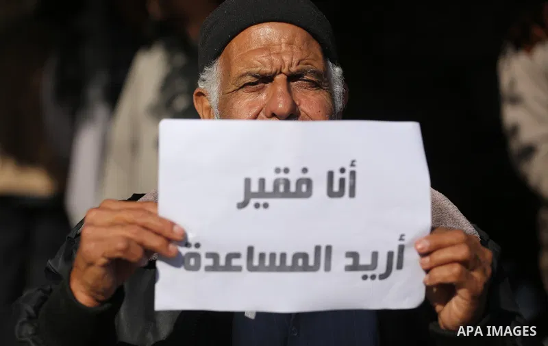 Palestinian orphans take part in a protest against the closure of the accounts of charities in Gaza city, on November 26, 2017. Photo by Mohammed Asad