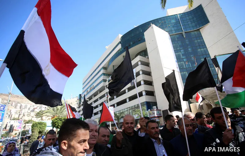 Palestinians take part in a protest in solidarity with Egyptian people after the deadly attack on a mosque in Egypt's Sinai, in the West Bank city of Nablus, on Nov. 26, 2017. According to latest reports, a bomb and gunf...