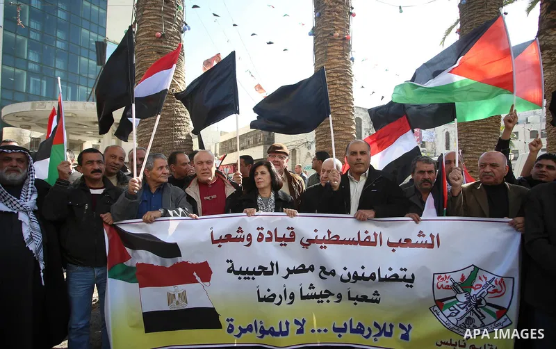 Palestinians take part in a protest in solidarity with Egyptian people after the deadly attack on a mosque in Egypt's Sinai, in the West Bank city of Nablus, on Nov. 26, 2017. According to latest reports, a bomb and gunf...