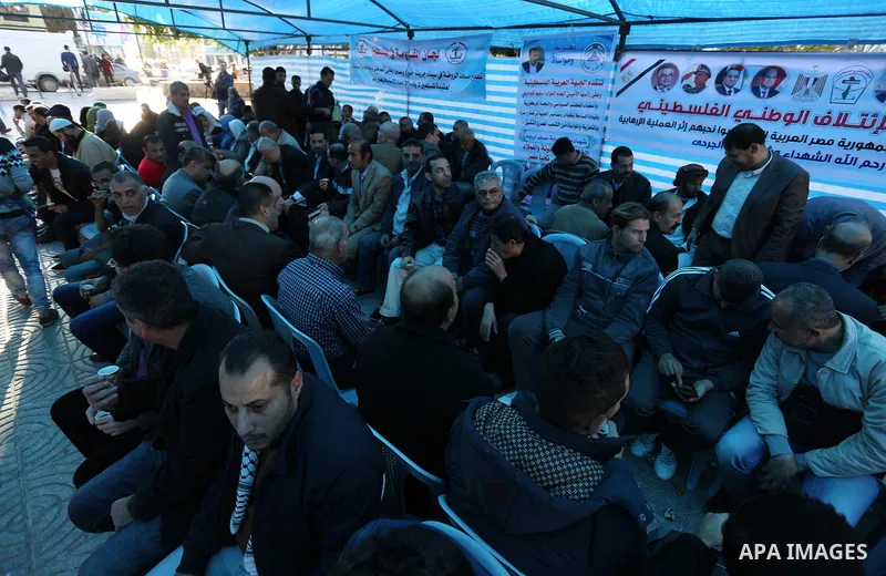 Palestinians take part in a mourning tent set up for people to pay their respects to the Egyptian victims after the deadly attack on a mosque in Egypt's Sinai, on November 26, 2017 in Gaza city. According to latest repor...