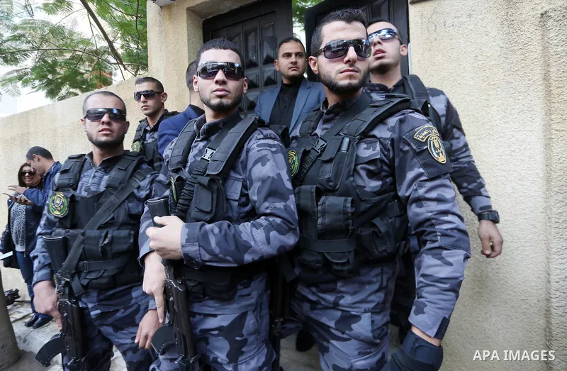 Palestinian security forces stand guard during a meeting between Palestinian Deputy Prime Minister Ziad Abu Amr and a delegation from Egypt’s General Intelligence in Gaza city on November 27, 2017. An Egyptian delegation...