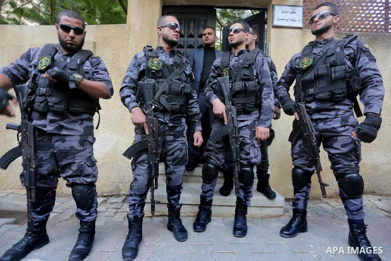 Palestinian security forces stand guard during a meeting between Palestinian Deputy Prime Minister Ziad Abu Amr and a delegation from Egypt’s General Intelligence in Gaza city on November 27, 2017. An Egyptian delegation...