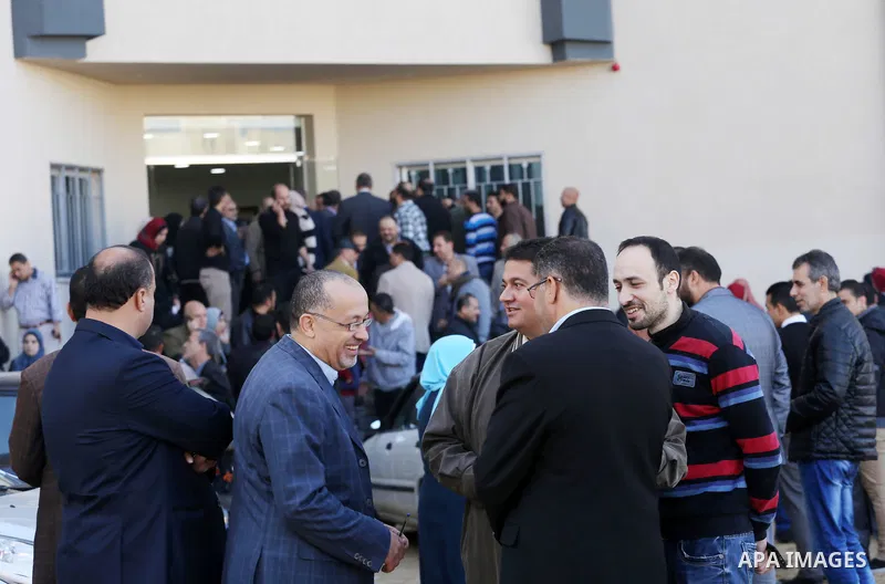 The Palestinian Authority employees, gather as they return to their offices in the headquarters of government ministries in the Gaza Strip in Gaza city on November 29, 2017. The Palestinian Authority began assuming power...