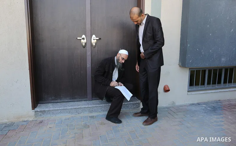 The Palestinian Authority employees, gather as they return to their offices in the headquarters of government ministries in the Gaza Strip in Gaza city on November 29, 2017. The Palestinian Authority began assuming power...