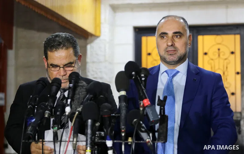 Fatah spokesperson and vice chairman of the Fatah Revolutionary Council, Fayez Abu Eita, speaks during a press conference alongside with Senior Hamas official Salah al-Bardawil, in Gaza city on November 29, 2017. Photo b...