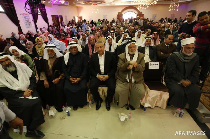 Palestinians attend the ceremony of "Mawlid al-Nabawi" or the birth of Prophet Mohammad, in Deir el-Balah in central of Gaza strip on November 30, 2017. Photo by Ashraf Amra