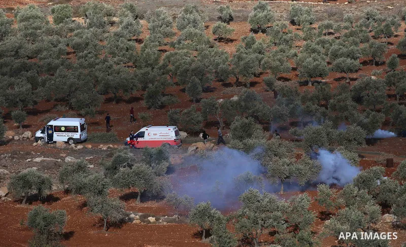 Palestinians throw stones at Israeli soldiers during clashes after confrontations with Israeli settlers in the village of Qusra, near the West Bank City of Nablus, 30 November 2017. According to reports, the Palestinian...