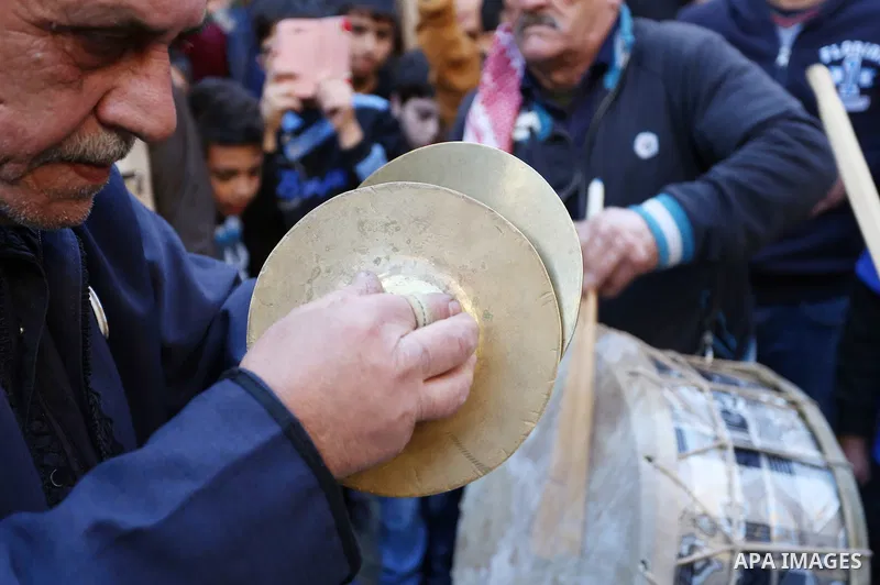 Worshipers sing and dance during a ceremony to commemorate the birth of the Prophet Mohamed in the West Bank city of Nablus, on Nov. 30, 2017. Photo by STR