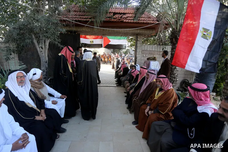 Heads of Palestinian families wait before a meeting with Egypt’s General Intelligence in Gaza city on December 1, 2017. Photo by Mohammed Asad