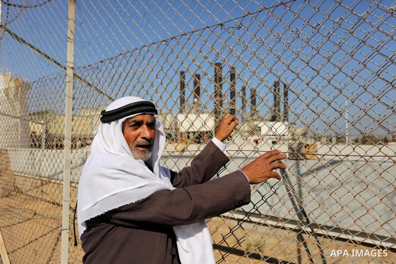 Palestinians take part during a protest against the ongoing electricity shortages in front of Gaza's power plant in Nuseirat, in the central of Gaza Strip on December 2, 2017. Photo by Ashraf Amra