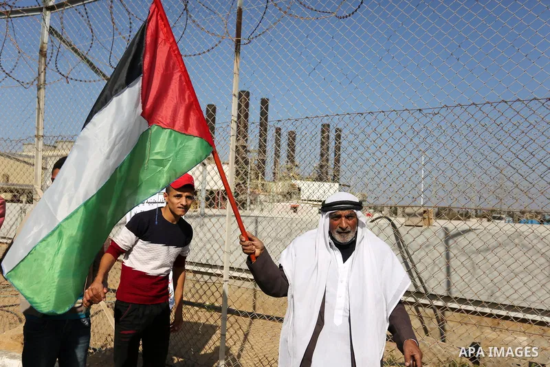 Palestinians take part during a protest against the ongoing electricity shortages in front of Gaza's power plant in Nuseirat, in the central of Gaza Strip on December 2, 2017. Photo by Ashraf Amra
