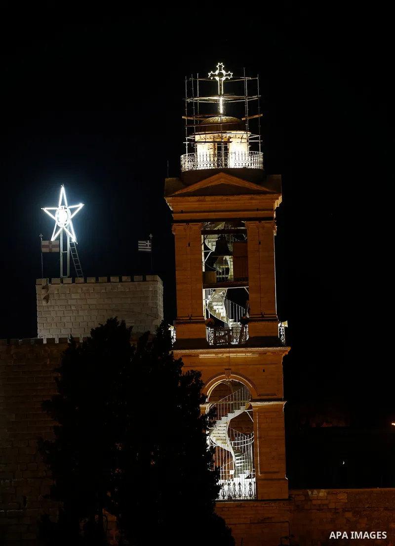 Fireworks explode during a Christmas tree lighting ceremony outside the Church of the Nativity in the West Bank town of Bethlehem, December 2, 2017. Photo by Wisam Hashlamoun