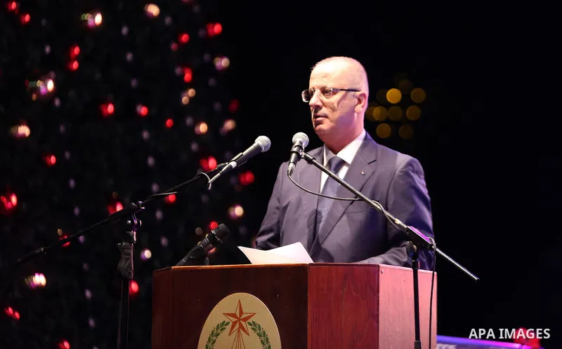 Palestinian Prime minister, Rami Hamdallah speaks during a Christmas tree lighting ceremony outside the Church of the Nativity in the West Bank town of Bethlehem, December 2, 2017. Photo by Prime Minister Office