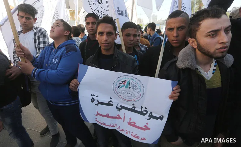 Palestinians from al-Ahrar movement take part during a protest demanding to lift sanctions on the Gaza Strip on December 3, 2017 in Gaza city. Photo by Mohammed Asad