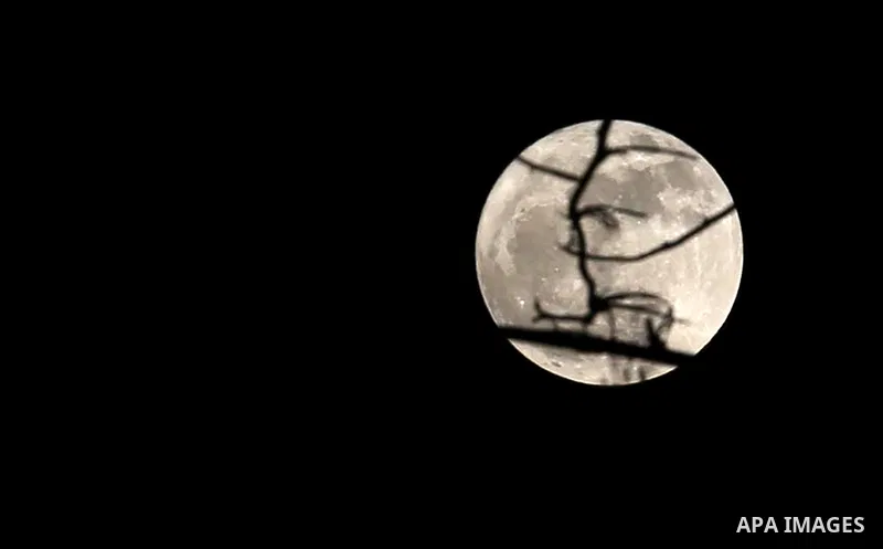 The 'supermoon' is seen in the Gaza city, on December 3, 2017. The lunar phenomenon occurs when a full moon is at its closest point to earth. Photo by Mohammed Asad
