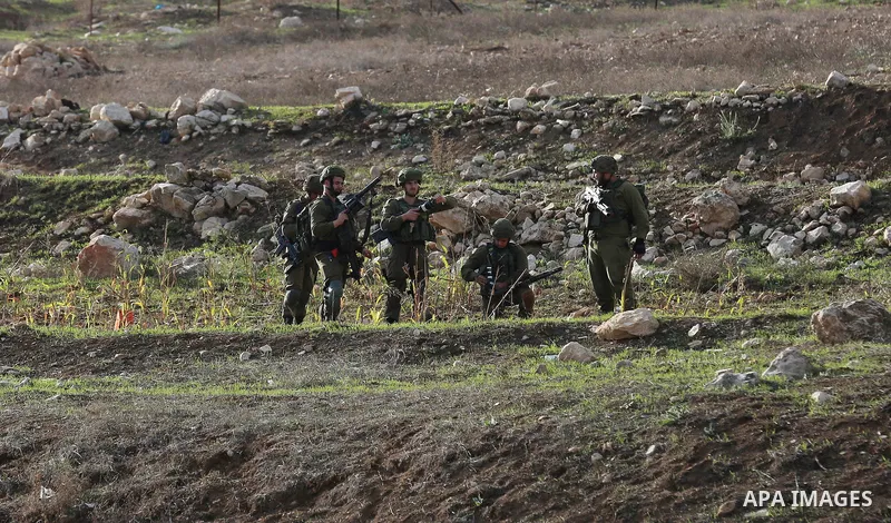Palestinians throws stones at Israeli troops during clashes in Hawara checkpoint, south of the West Bank city of Nablus, following a demonstration against US President Donald Trump's decision to recognise Jerusalem as th...
