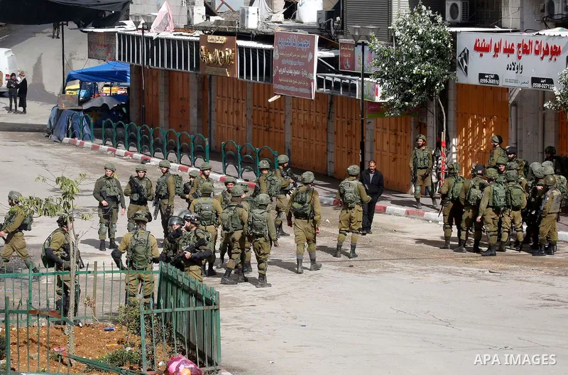 Israeli border policemen take position during clashes that followed protests against a decision by US President Donald Trump to recognise Jerusalem as the capital of Israel, in the West Bank city of hebron on December 7,...