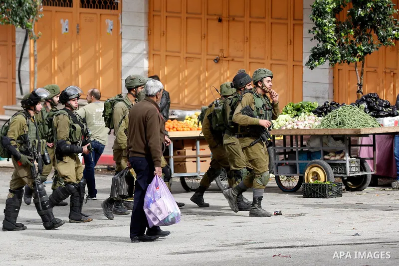 Israeli border policemen take position during clashes that followed protests against a decision by US President Donald Trump to recognise Jerusalem as the capital of Israel, in the West Bank city of hebron on December 7,...