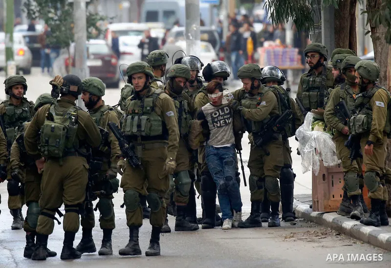 Israeli forces detain a Palestinian protester during clashes that followed protests against a decision by US President Donald Trump to recognise Jerusalem as the capital of Israel, in Hebron in the Israeli-occupied West...
