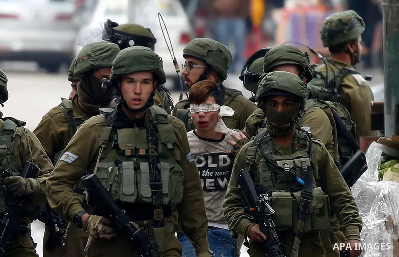 Israeli forces detain a Palestinian protester during clashes that followed protests against a decision by US President Donald Trump to recognise Jerusalem as the capital of Israel, in Hebron in the Israeli-occupied West...