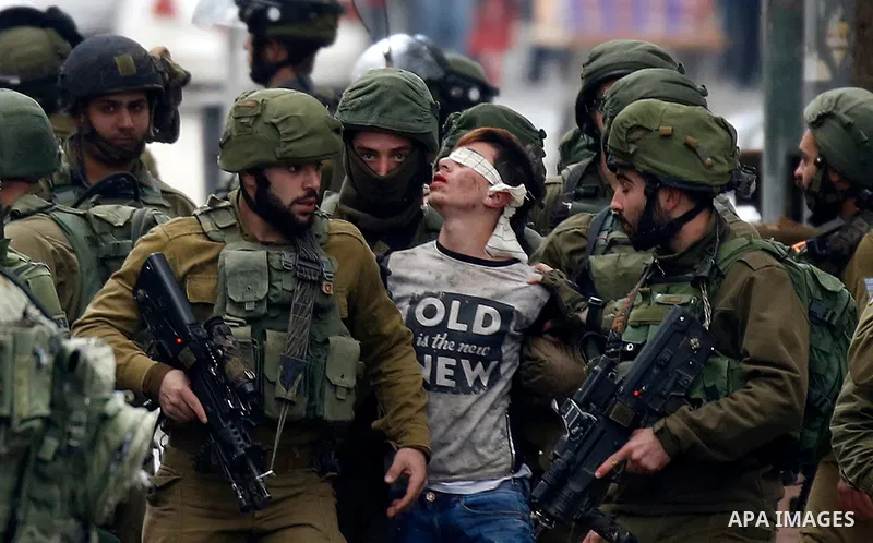 Israeli forces detain a Palestinian protester during clashes that followed protests against a decision by US President Donald Trump to recognise Jerusalem as the capital of Israel, in Hebron in the Israeli-occupied West...