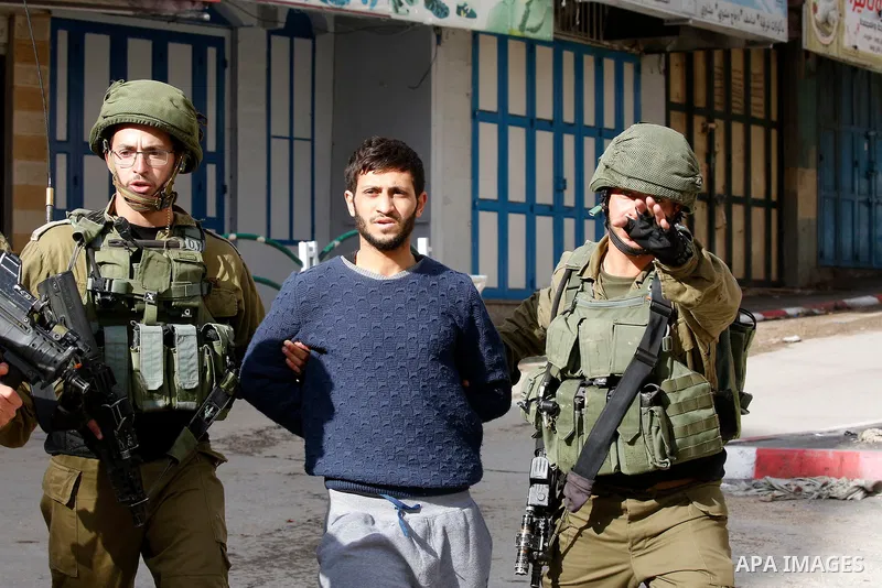 Israeli forces detain a Palestinian protester during clashes that followed protests against a decision by US President Donald Trump to recognise Jerusalem as the capital of Israel, in Hebron in the Israeli-occupied West...