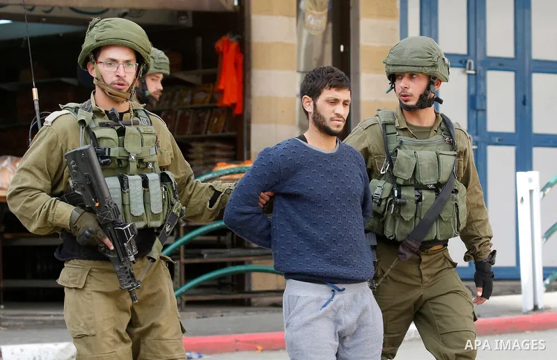 Israeli forces detain a Palestinian protester during clashes that followed protests against a decision by US President Donald Trump to recognise Jerusalem as the capital of Israel, in Hebron in the Israeli-occupied West...